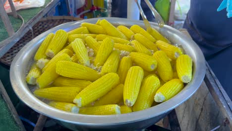 corn being prepared at bangkok's floating market