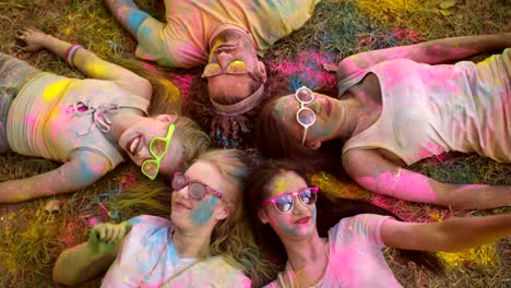 multi-ethnic group celebrating holi festival in park