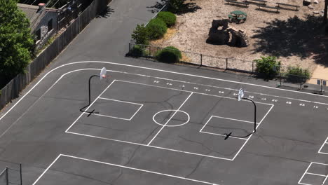 overhead view of basketball court on blacktop at a middle school playground