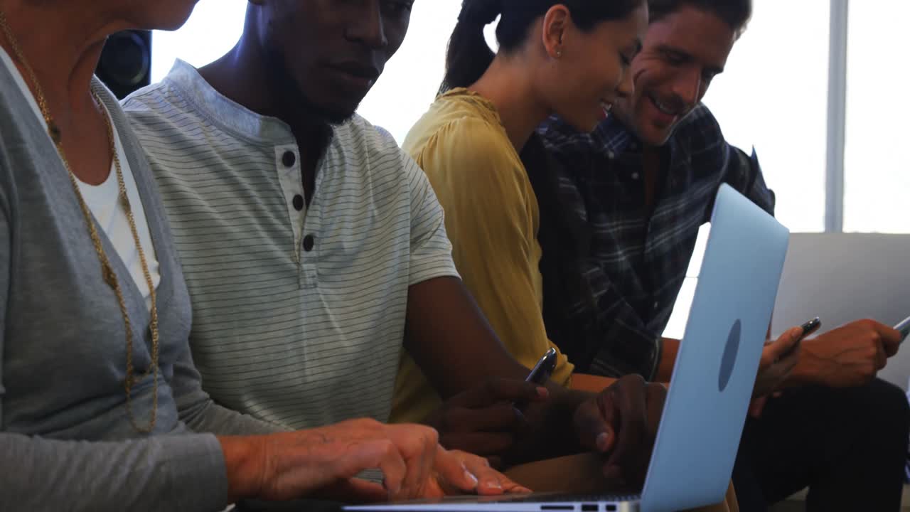 Executives using laptop