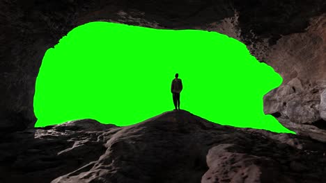 Adventure-Man-Hiker-standing-in-Rocky-cave-on-top-of-Mountain