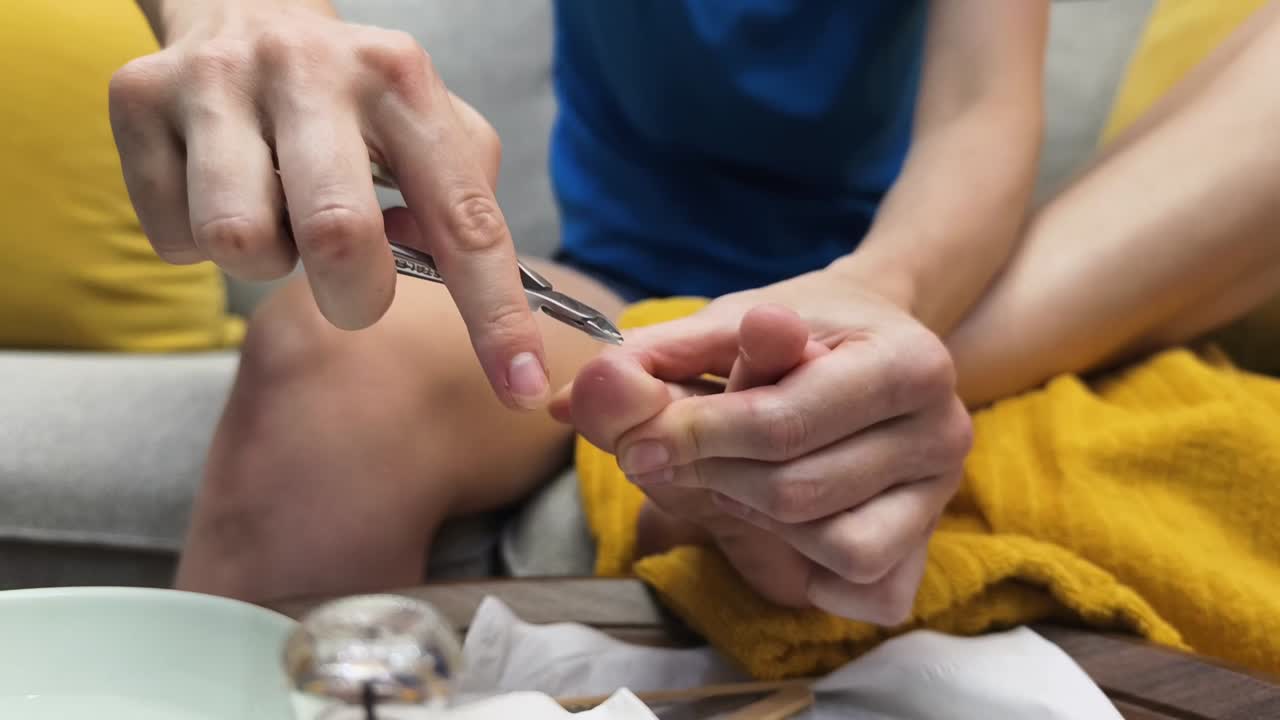 Woman Filing Toenails During Pedicure