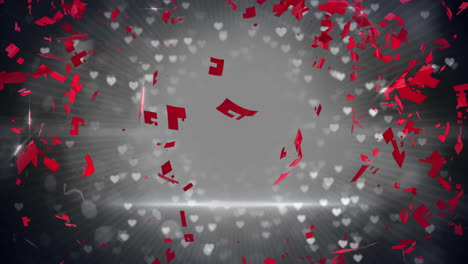 Red-heart-turning-and-exploding-on-glittering-background