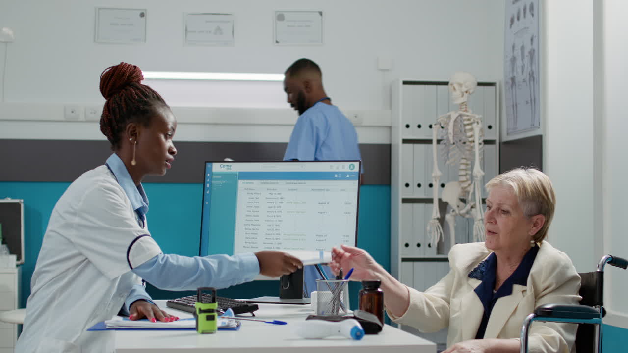 Medical consultation with doctor and elderly patient in hospital