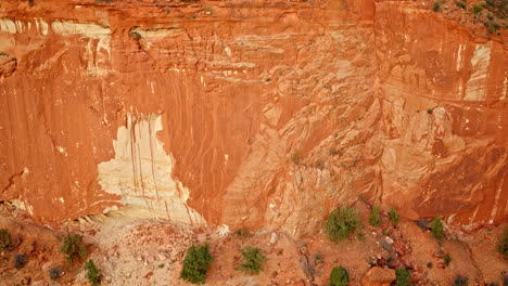 aerial tracking shot revealing the toadstool hoodoos’ dramatic formations and colorful terrain.
