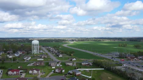 Time-lapse-of-suburban-neighborhood-with-fluffy-clouds-and-blue-skies