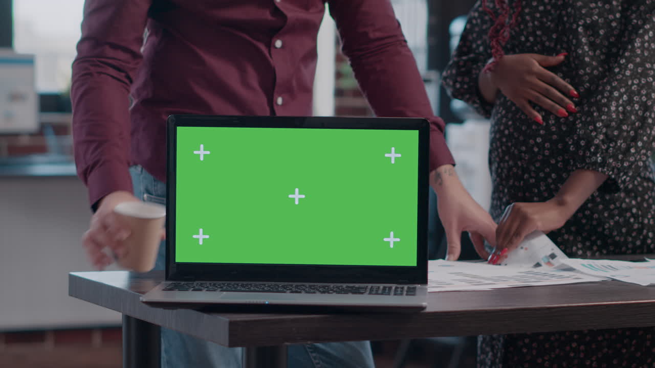 Close up of business people having laptop with horizontal green screen