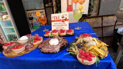 delicious italian dishes on a vibrant blue tablecloth