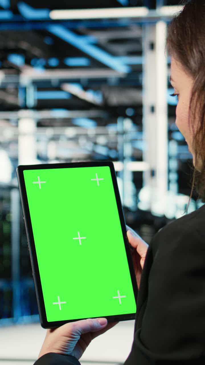 Vertical video Green screen tablet used by data center admin to optimize server load balancing