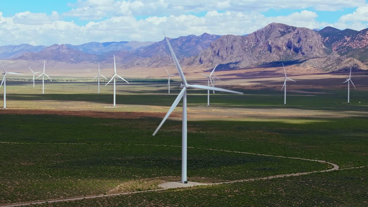 Wind turbines spin in sunny Nevada, conveying renewable energy concept