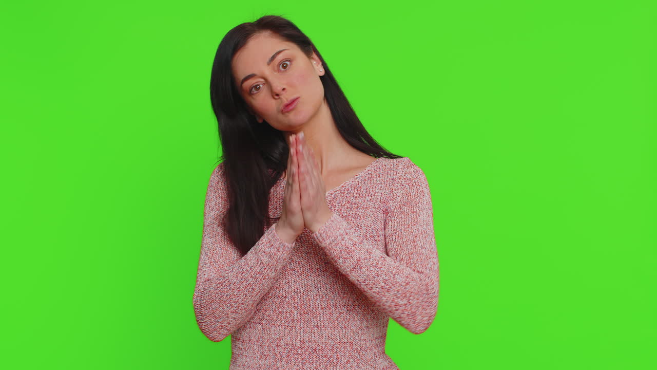 Young woman sincerely praying to God forgive me begging apology, asking for help pleading expression
