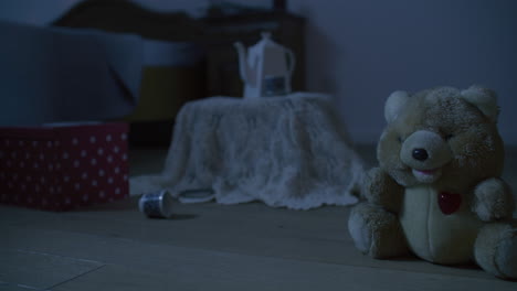 teddy bear in a bedroom at night