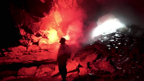 explorer in a cave at night