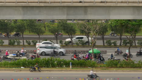 huge flow of traffic pass roadside vendor on busy vietnam highway