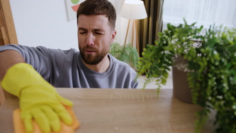 man cleaning the bookshelf