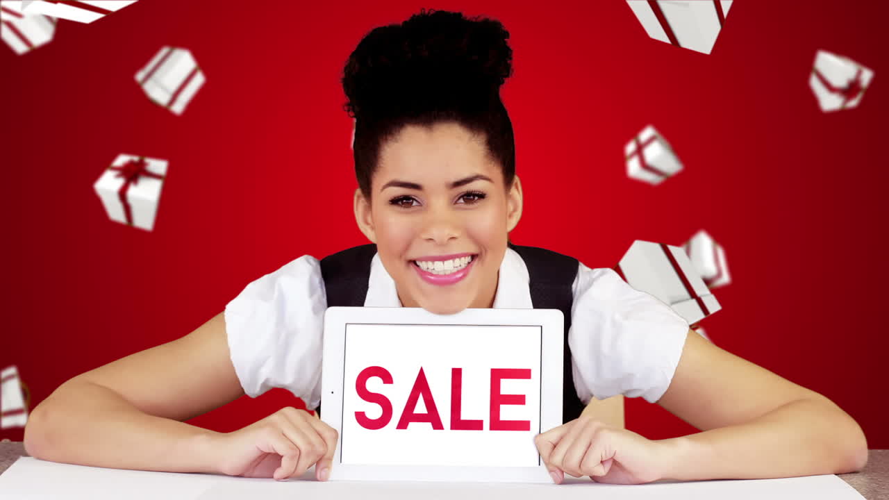 Pretty woman showing tablet with sale on screen