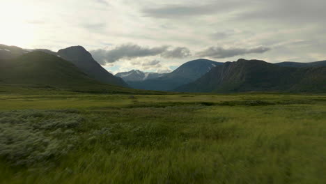 Flying-Through-Vast-Moorland-With-Jotunheim-Mountainous-Landscape