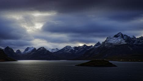 Cold-wind-blows-in-the-Norwegian-fjord-surrounded-by-snow-covered-mountains