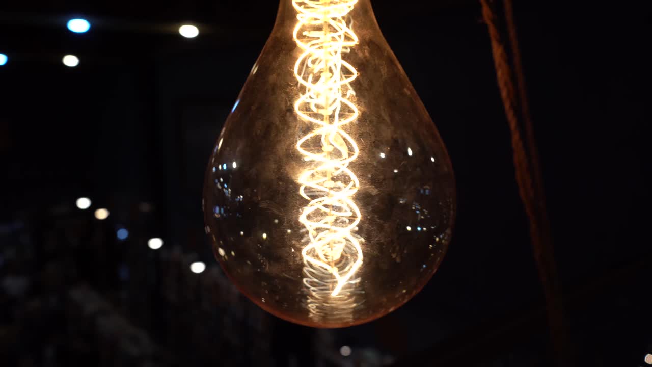 A hanging vintage light bulb handging from ceiling.