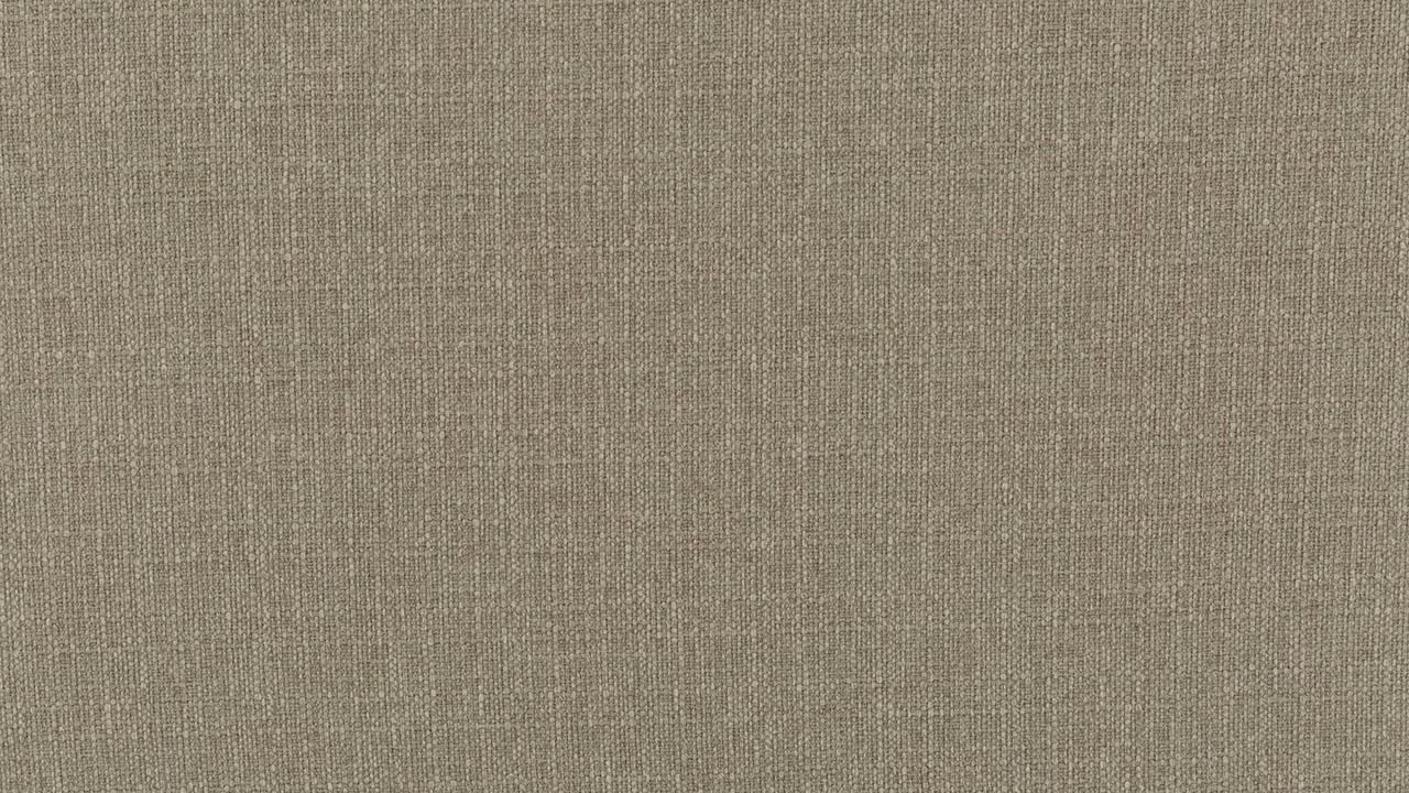 un zoom lento en primer plano de beige marrón lana poliéster tapicería textura acabado superficie tejido patrón tela en un sofá asiento de amor muebles seccionales fondo