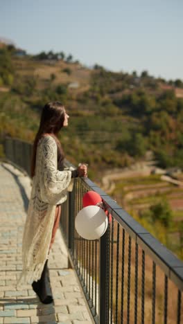 woman enjoying a scenic mountain view