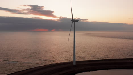 Windturbines-and-aquaculture-during-sunset-on-the-island-Neeltje-Jans,-the-Netherlands