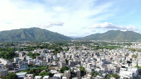 Hong-Kong-Pat-Heung-village-houses-with-MTR-maintenance-centre,-Aerial-view