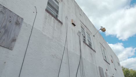 Wires-and-Broken-Light-Outside-of-Abandoned-Store-Building