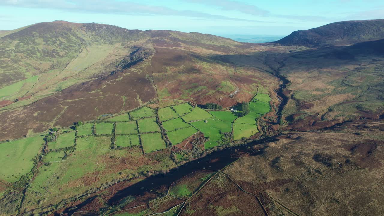 Irish drone Landscapes Nire Valley Comeragh Mountains Waterford homestead and farmland on the edge of the mountains autumn