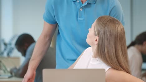 Man-hands-touch-business-woman-working-on-notebook-at-coworking