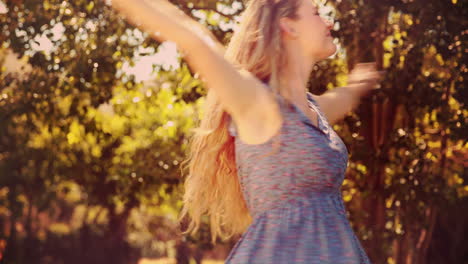 in high quality 4k format pretty blonde smiling in the park