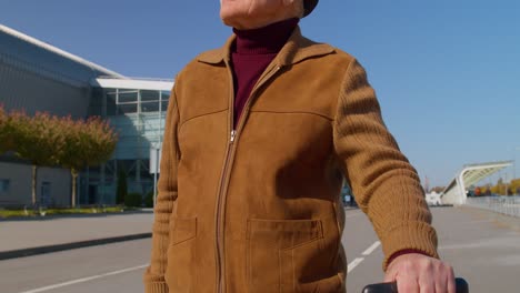 Portrait-of-senior-pensioner-tourist-grandfather-stay-near-airport-hall-waiting-for-plane,-travel