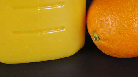 Orange-fruit-vs-juice,-citrus,-food,-fresh-drink,-juicy,-vitamin,-vegetables,-macro-studio-shot-illustration,-nutrition,-colorful-dessert,-aliment-fruits