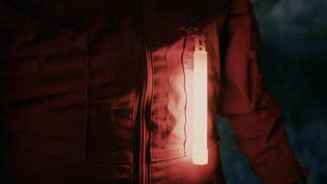 orange chemical stick light on an astronaut's suit