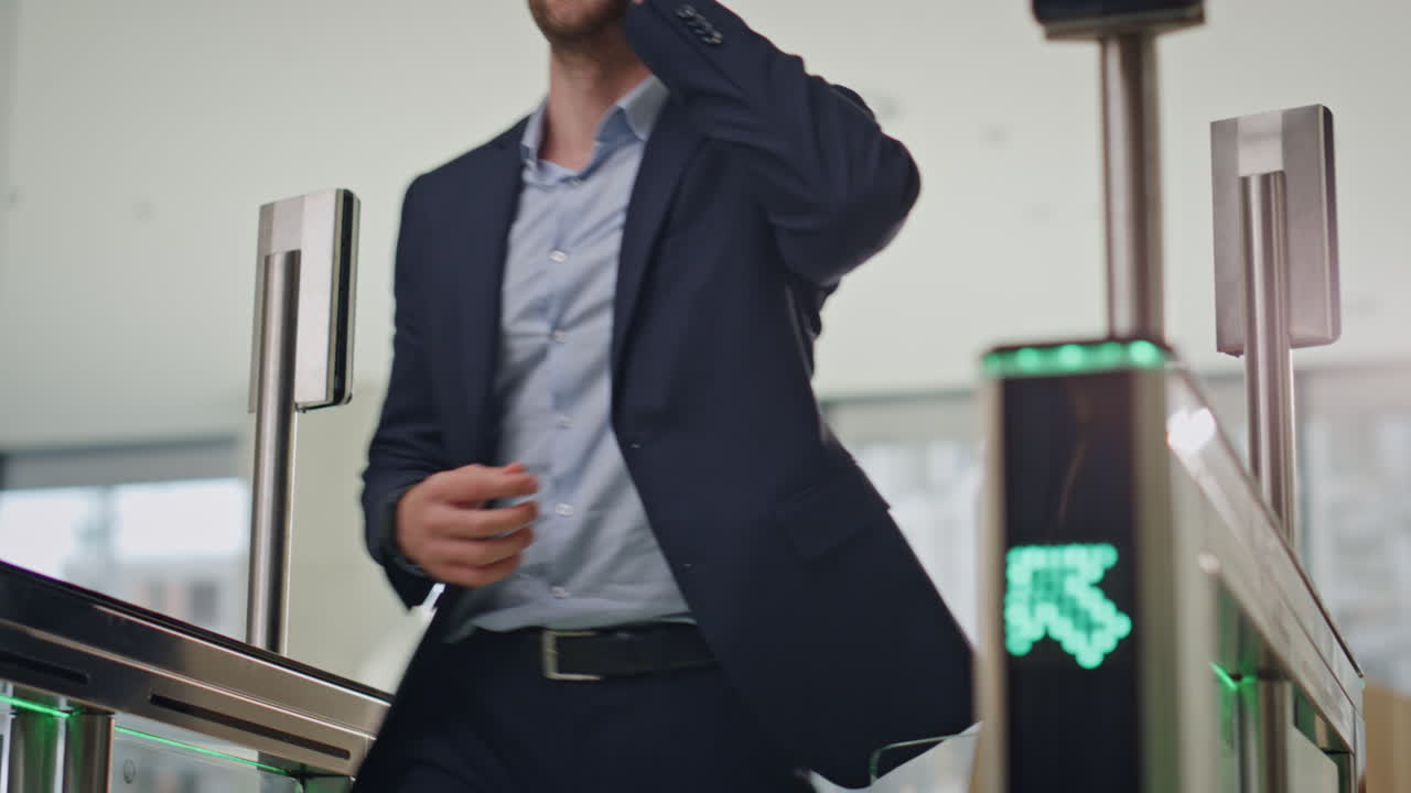 Businessman passing face identification walking to automatic office entrance