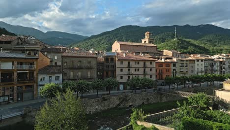 the main street in the town of la pobla de lillet in catalonia, aerial