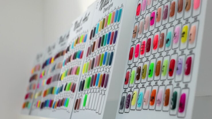 women gel nails on wall as selection in beauty salon - Steady shot