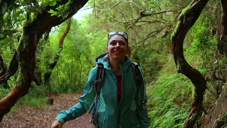 beautiful girl walks happy in the tropical forest of madeira, slowmotion shot