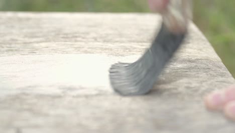 Painting-wooden-table-with-white-paint