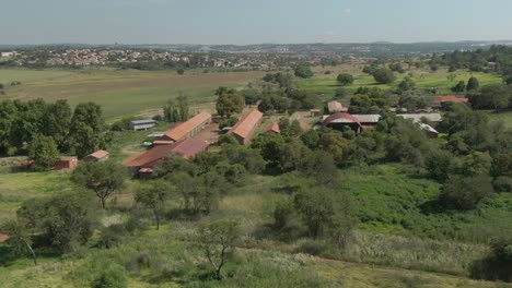 drone aerial footage of a farmstead and outbuildings