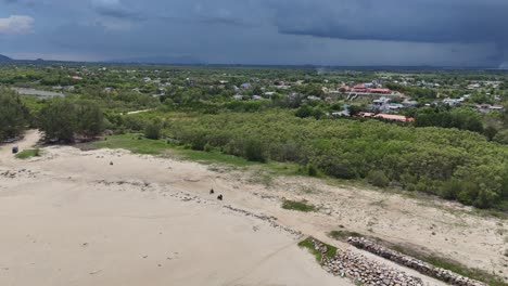aerial view dolly of the secret beach and the stormy clouds in vung tau