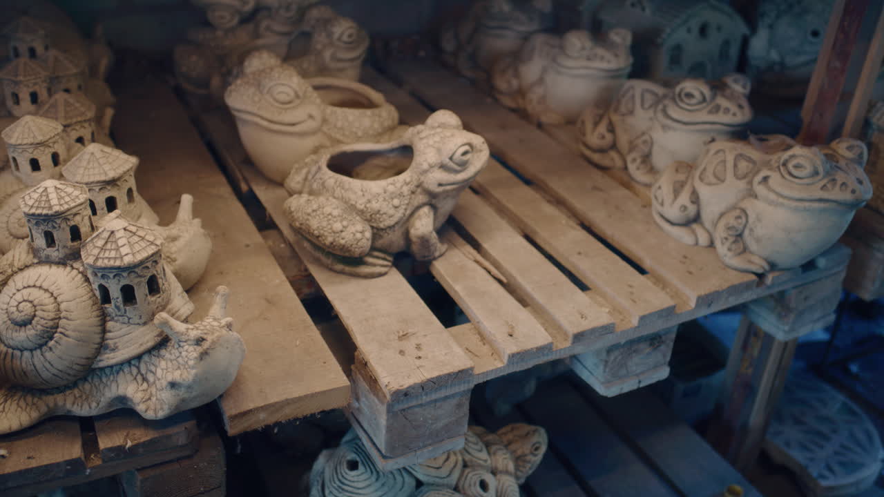 Artisan Inspecting Decorative Garden Sculptures