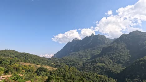 time-lapse of clouds over a tranquil mountain village