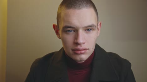 Straight-Face-Young-Man-Looking-Directly-To-The-Camera---Closeup-Shot