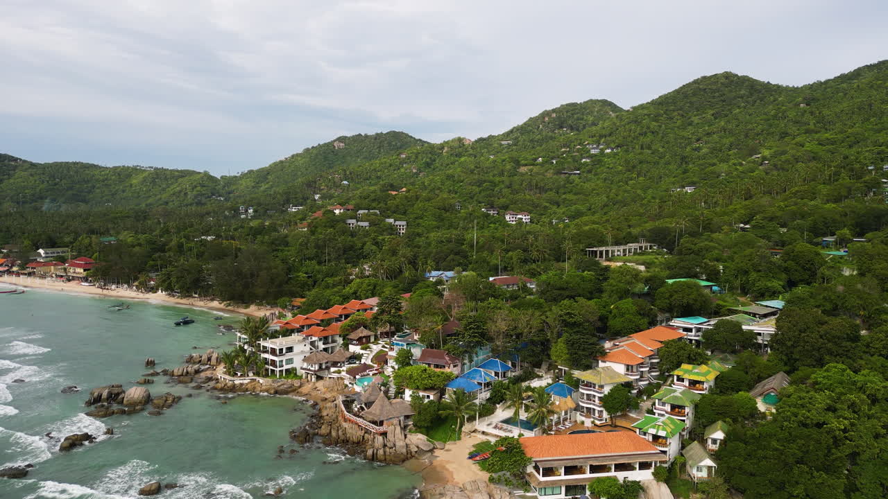 Strong winds pushing waves of water towards the shore in Koh Tau Thailand, aerial orbital