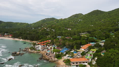 strong winds pushing waves of water towards the shore in koh tau thailand, aerial orbital