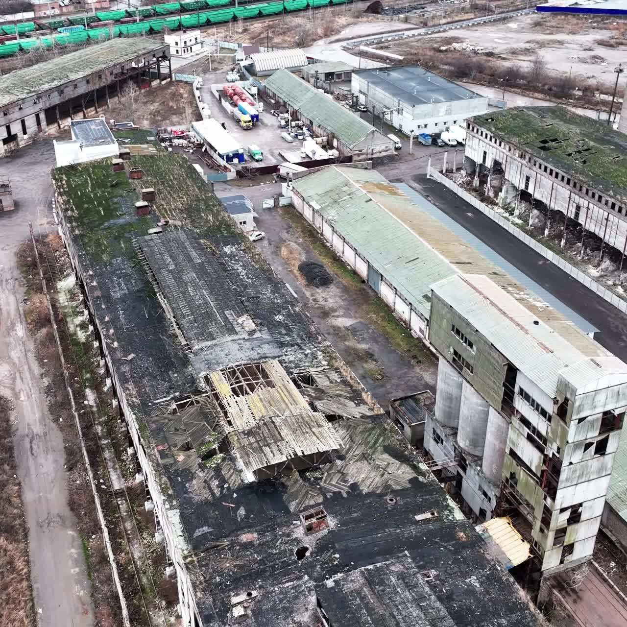 Desolate industrial area with old plant constructions. Large plant territory devastated by time. Aerial view