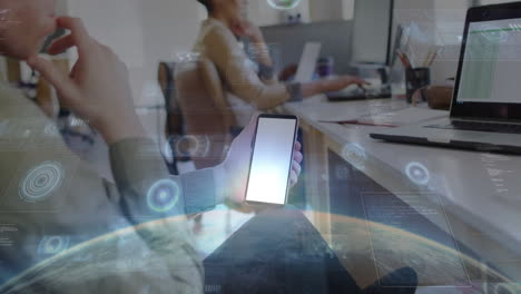 people working at desks with digital data processing animation over smartphone
