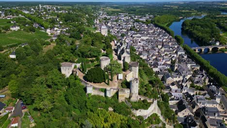 Panoramic drone fly around the medieval castle of Forteresse Royale de Chinon within a French riverside, Chinon, Indre-et-Loire, France
