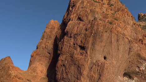 Spectacular-red-rock-at-Scandola-peninsula-nature-reserve-and-contrast-with-blue-sky,-Corsica-island-in-France